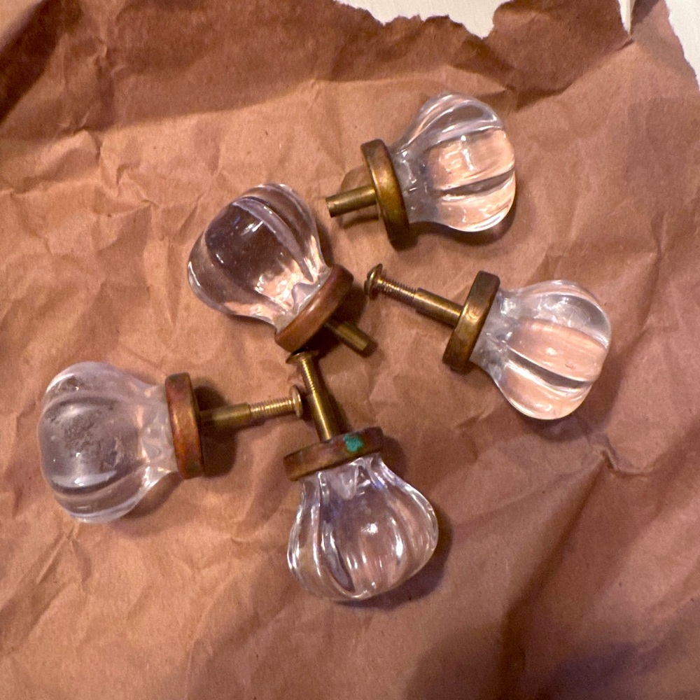 Five vintage glass drawer pulls.